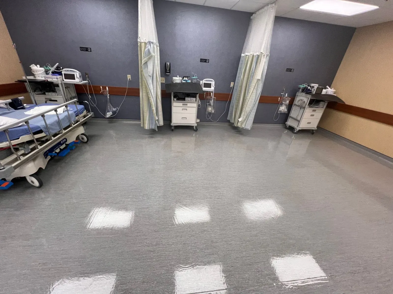 Clinic recovery bays with a clean, shining vinyl floor