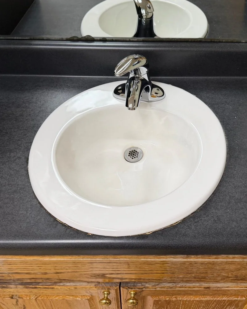 Restroom sink and counter after cleaning in Lawrenceville, GA