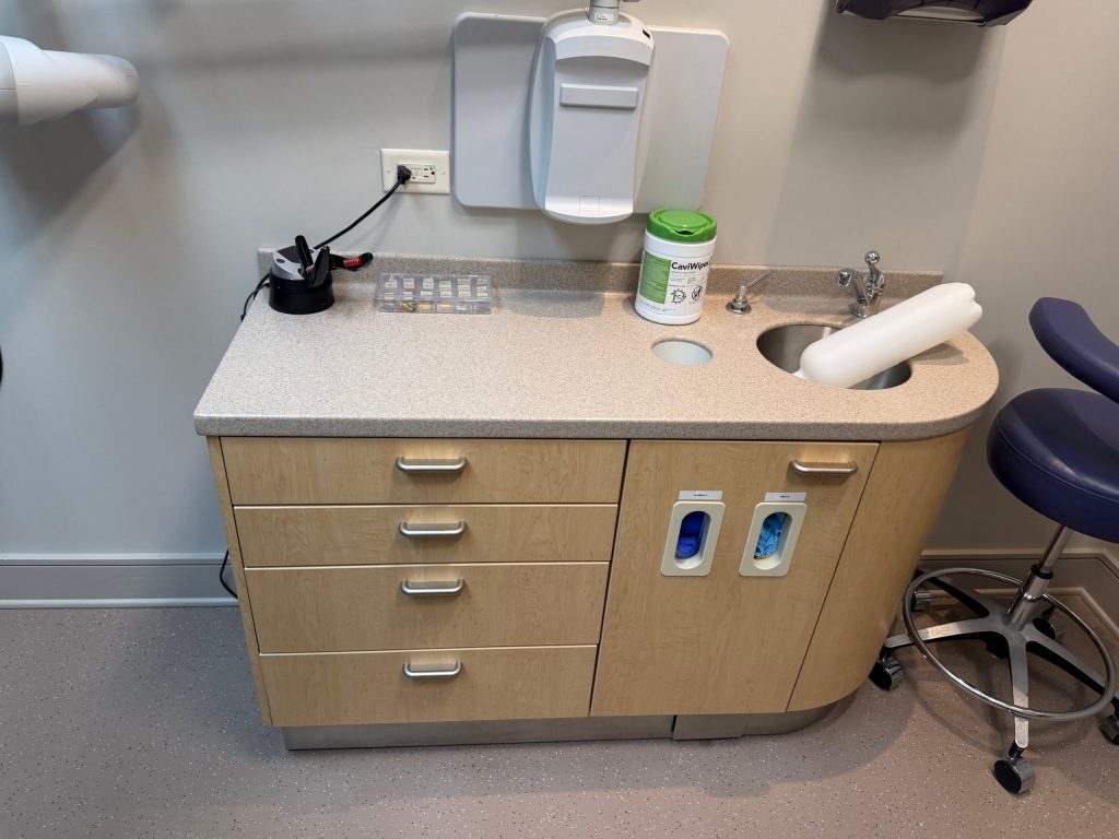 Wiped-down counter and sink in a dental treatment room in Lilburn, GA