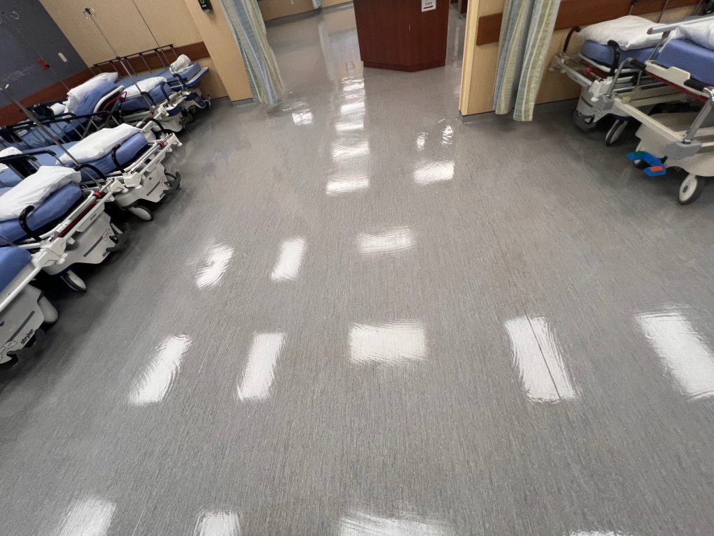Freshly finished floor between patient stretcher bays in a Lawrenceville, GA medical facility