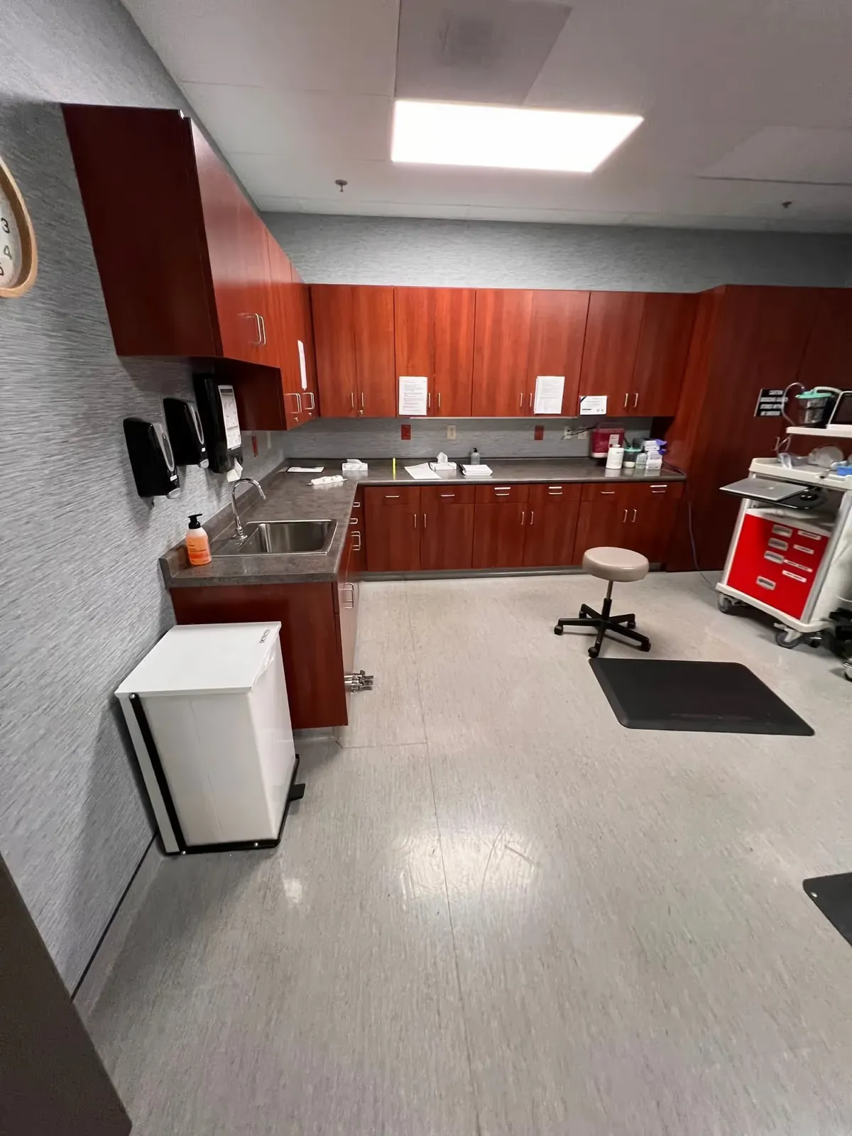 Medical office sink and cabinets wiped down