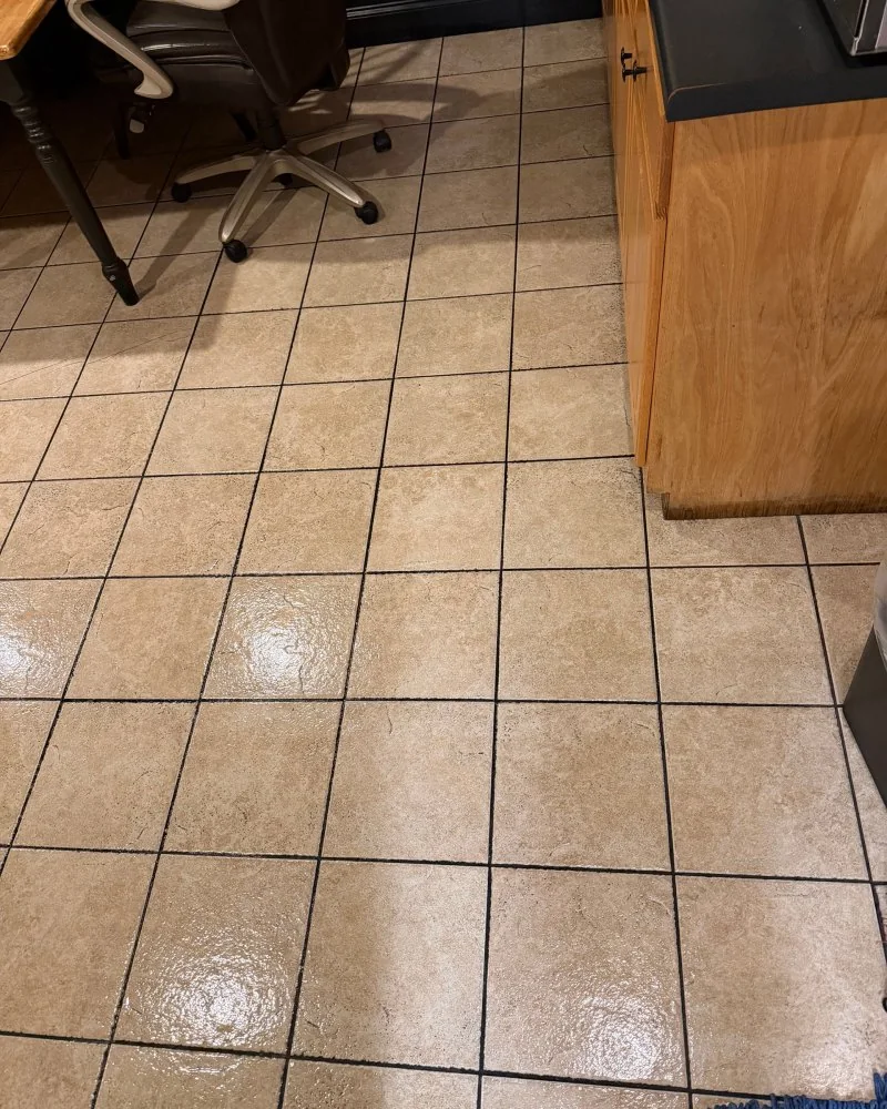 Clean tile floor beside the cabinets in an office break room after cleaning in Lawrenceville, GA